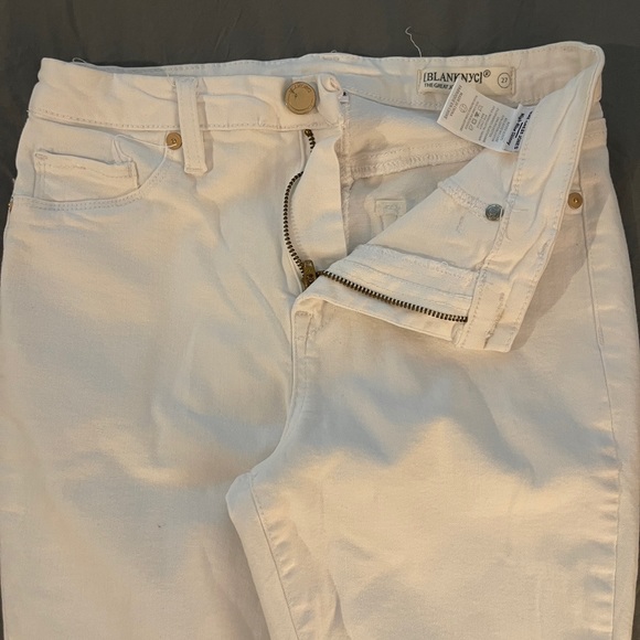 White skinny jeans with stretch and slightly distressed.  Never been worn. 27 - Picture 4 of 10